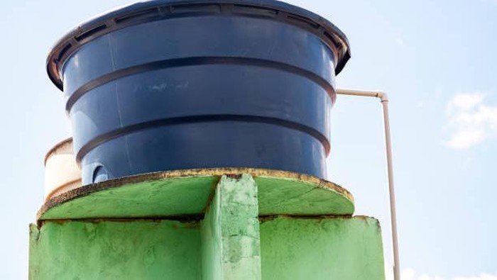 Blue plastic water tank used in residential constructions in Brazil