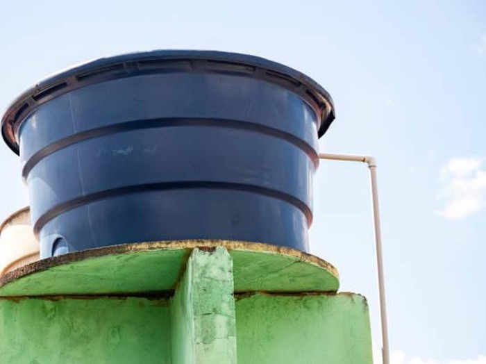 Blue plastic water tank used in residential constructions in Brazil
