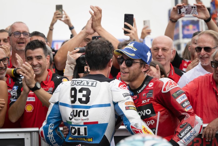 MISANO ADRIATICO, ITALY - SEPTEMBER 08: Marc Marquez of Spain and Gresini Racing MotoGP celebrates the victory with Enea Bastianini of Italy and Ducati Lenovo Team (R)  under the podium during the MotoGP race during the MotoGP Of San Marino - Race at Misano World Circuit on September 08, 2024 in Misano Adriatico, Italy. (Photo by Mirco Lazzari gp/Getty Images)
