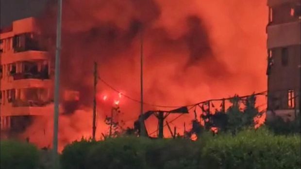 Smoke and flames rise near the hotel Beirut Golden Plaza, following an airstrike amid ongoing hostilities between Hezbollah and Israeli forces, in Beirut, Lebanon October 5, 2024, in this screengrab obtained from a social media video. SOCIAL MEDIA/via REUTERS  THIS IMAGE HAS BEEN SUPPLIED BY A THIRD PARTY. NO RESALES. NO ARCHIVES.