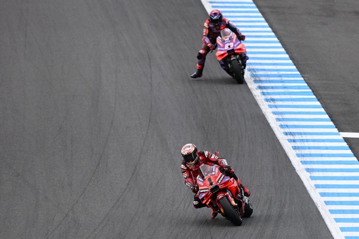 Ducati Lenovo Team rider Francesco Bagnaia of Italy (front) leads Prima Pramac Racing rider Jorge Martin of Spain during the MotoGP Japanese Grand Prix at the Mobility Resort Motegi in Motegi, Tochigi prefecture on October 6, 2024. (Photo by Toshifumi KITAMURA / AFP)
