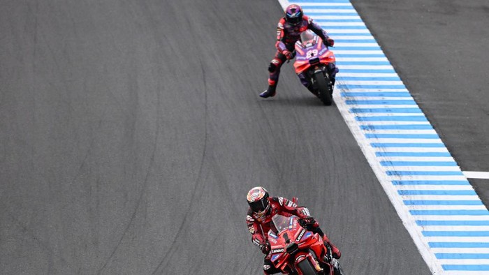 Ducati Lenovo Team rider Francesco Bagnaia of Italy (front) leads Prima Pramac Racing rider Jorge Martin of Spain during the MotoGP Japanese Grand Prix at the Mobility Resort Motegi in Motegi, Tochigi prefecture on October 6, 2024. (Photo by Toshifumi KITAMURA / AFP)