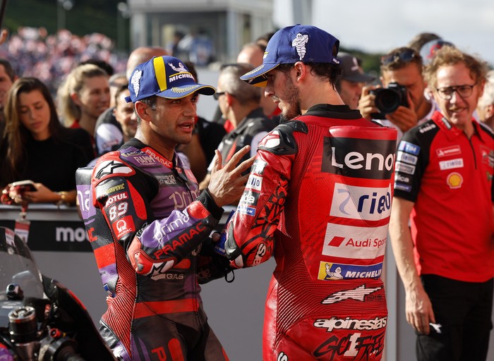 MotoGP - Japanese Grand Prix - Mobility Resort Motegi, Motegi, Japan - October 6, 2024 Ducati Lenovo Teams Francesco Bagnaia celebrates after winning the Japanese Grand Prix with second placed Prima Pramac Racings Jorge Martin REUTERS/Kim Kyung-Hoon