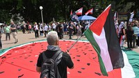 Aksi bela Palestina digelar di Sydney, Australia, Minggu (6/10) waktu setempat. AAP/Mick Tsikas via REUTERS.