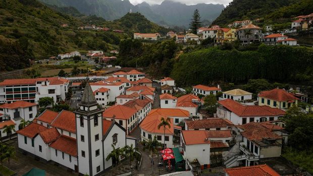 People enjoy a natural swimming pool in Porto Moniz on the Portuguese island of Madeira, Portugal, October 6, 2024. REUTERS/Pedro Nunes