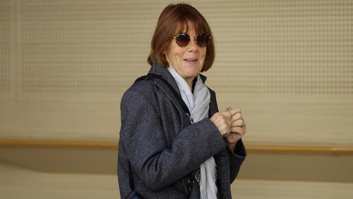Gisele Pelicot, who has allegedly been drugged and raped by men solicited by her husband Dominique Pelicot at their home in the southern French town of Mazan, arrives during the trial of her husband with 50 co-accused, at the courthouse in Avignon, France, September 30, 2024. REUTERS/Manon Cruz