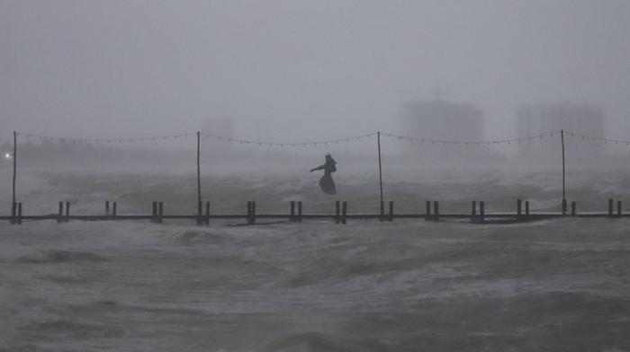 A sculpture of Poseidon stands in the ocean after the eye of Hurricane Milton passed off the coast of Progreso, Yucatan state, Mexico, Tuesday, Oct. 8, 2024. (AP Photo/Martin Zetina)