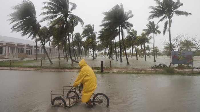 A sculpture of Poseidon stands in the ocean after the eye of Hurricane Milton passed off the coast of Progreso, Yucatan state, Mexico, Tuesday, Oct. 8, 2024. (AP Photo/Martin Zetina)