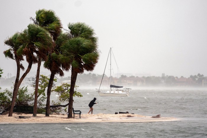 SARASOTA, FLORIDA - OCTOBER 9: A person fishes as Hurricane Milton approaches on October 9, 2024 in Sarasota, Florida. Milton, which comes just after the recent catastrophic hurricane Helene, will hit Floridas central Gulf Coast and is expected to make landfall with destructive winds and flooding. Sean Rayford/Getty Images/AFP
Sean Rayford / GETTY IMAGES NORTH AMERICA / Getty Images via AFP