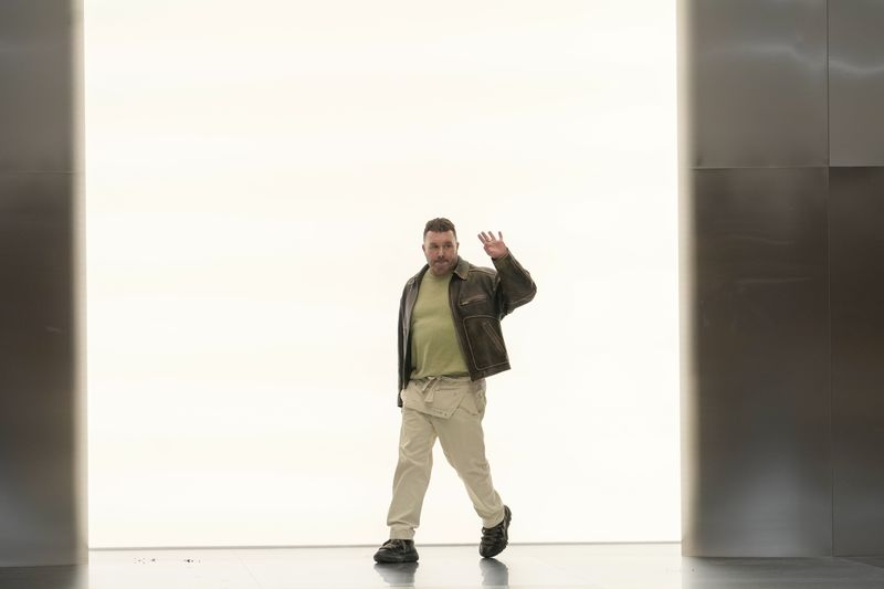Designer Kim Jones accepts applause after the Fendi Haute Couture Spring-Summer 2024 collection presented in Paris, Thursday, Jan. 25, 2024. (AP Photo/Thibault Camus)