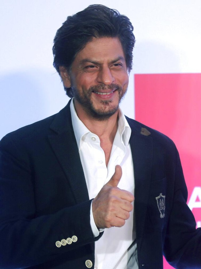 Bollywood actor Shah Rukh Khan greets media as he leaves after presenting the Shah Rukh Khan La Trobe University PhD Scholarship to a student in Mumbai, India, Wednesday, Feb. 26, 2020. (AP Photo/Rafiq Maqbool)
