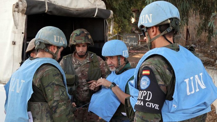 Spanish peacekeepers of the United Nations Interim Force in Lebanon (UNIFIL) coordinate their patrol with the Lebanese army, in Marjayoun in south Lebanon on October 8, 2024. (Photo by AFP)