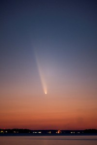 Comet C/2023 A3 (Tsuchinshan-ATLAS) is visible shortly after sunset in the western sky over the Lake Murray Dam Hydroelectric Intake Towers near Columbia, South Carolina, U.S. October 12, 2024.  REUTERS/Sam Wolfe