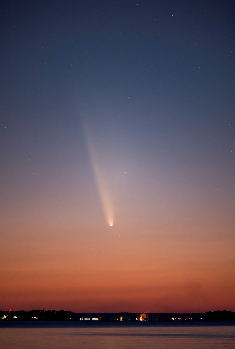 Comet C/2023 A3 (Tsuchinshan-ATLAS) is visible shortly after sunset in the western sky over the Lake Murray Dam Hydroelectric Intake Towers near Columbia, South Carolina, U.S. October 12, 2024.  REUTERS/Sam Wolfe