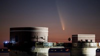 Comet C/2023 A3 (Tsuchinshan-ATLAS) is visible shortly after sunset in the western sky over the Lake Murray Dam Hydroelectric Intake Towers near Columbia, South Carolina, U.S. October 12, 2024.  REUTERS/Sam Wolfe