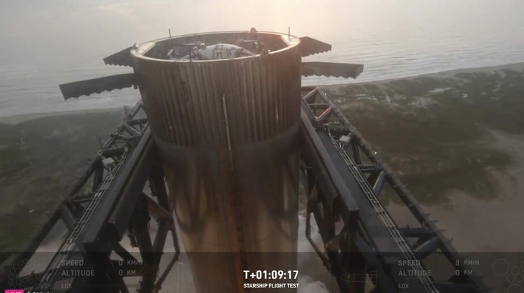This image provided by SpaceX shows SpaceXs mega rocket booster returning to the launch pad to be captured during a test flight Sunday, Oct. 13, 2024, in Boca Chica, Texas. (SpaceX via AP)