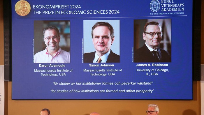 Academy of Sciences permanent secretary Hans Ellegren, Jakob Svensson and Jan Teorell, of the Nobel Assembly at the Swedish Riksbank announces the Swedish Riksbanks prize in economic science in memory of Alfred Nobel 2024, which goes to Daron Acemoglu, Simon Johnson and James A Robinson, during a press meeting at the Royal Swedish Academy of Sciences in Stockholm, Sweden, October 14, 2024.