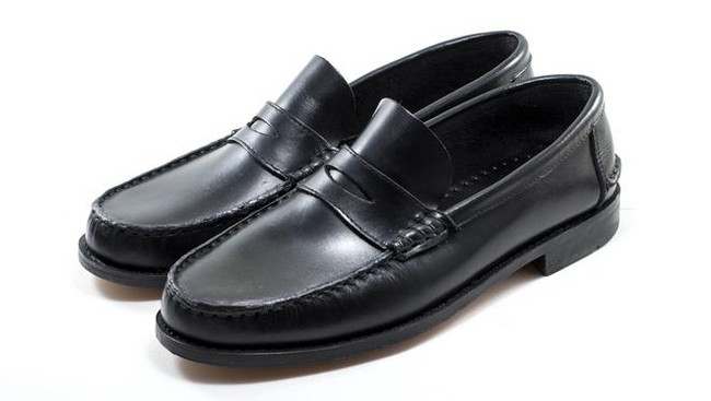 A mens black loafers isolated on white background