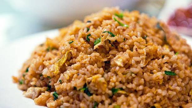 Soy sauce fried rice served in porcelain plate