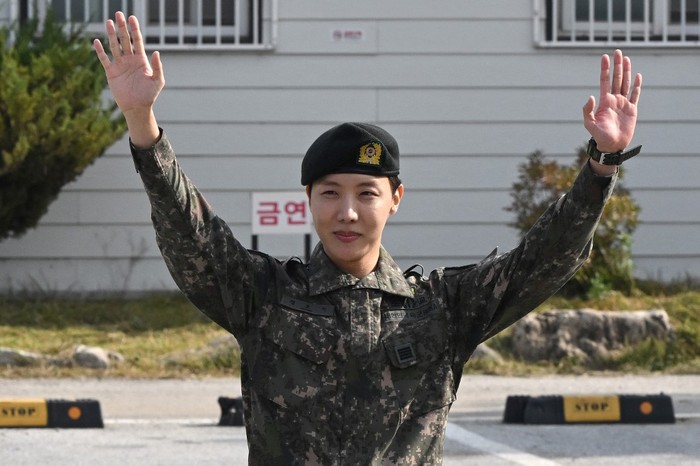 BTS member J-hope reacts after being discharged from his mandatory military service outside a military base in Wonju on October 17, 2024. K-pop megastar J-hope from BTS ended eighteen months of South Korean military service on October 17, and hailed the sacrifice of soldiers working to keep the country safe, as fans wept for joy at his return to the industry. (Photo by JUNG YEON-JE / AFP)