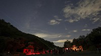 People attend a stargazing and comet-watching gathering at Joya-La Barreta ecological park as comet Tsuchinshan–ATLAS flies overhead in Queretaro, Mexico, Saturday, Oct. 19, 2024. (AP Photo/Ginnette Riquelme)