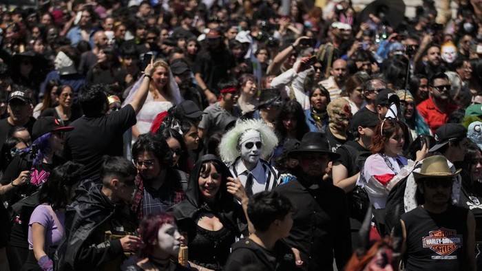 A reveler poses for a photo during the annual zombie parade in Santiago, Chile, Sunday, Oct. 20, 2024. (AP Photo/Esteban Felix)