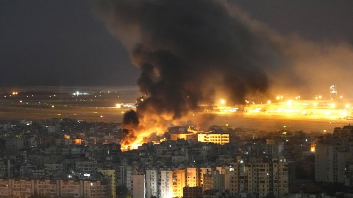 Flames and smoke rise form Israeli airstrikes on Dahiyeh, in the southern suburb of Beirut, Lebanon, Sunday, Oct. 20, 2024. (AP Photo/Hussein Malla)