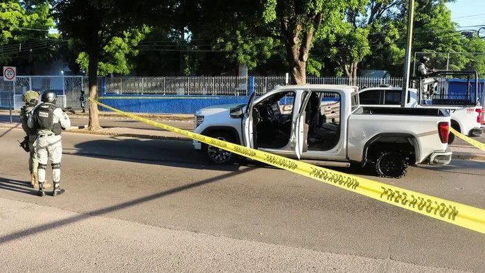 Mexican security forces respond at the scene of a damaged automobile after a confrontation between armed groups, in Culiacan, Mexico September 9, 2024. (Reuters)