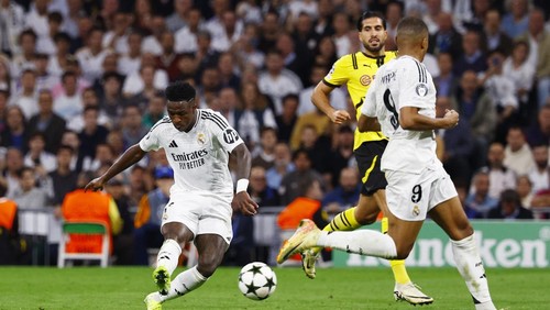 Soccer Football - Champions League - Real Madrid v Borussia Dortmund - Santiago Bernabeu, Madrid, Spain - October 22, 2024 Real Madrids Vinicius Junior scores their fourth goal REUTERS/Susana Vera