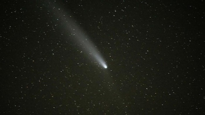 Comet C/2023 A3 - Tsuchinshan-ATLAS is seen in the sky above the artwork Dodekalitten at Lolland southern Zealand, Denmark October 22, 2024. Ritzau Scanpix/Mads Claus Rasmussen via REUTERS    ATTENTION EDITORS - THIS IMAGE WAS PROVIDED BY A THIRD PARTY. DENMARK OUT. NO COMMERCIAL OR EDITORIAL SALES IN DENMARK.