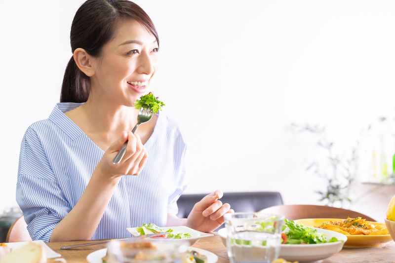 young attractive asian woman who eats
