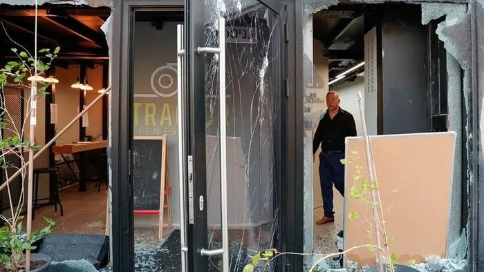 A man stands at a damaged gym in the aftermath of a projectile impact, amid ongoing hostilities between Hezbollah and Israeli forces, in Majd al-Krum, northern Israel October 25, 2024. (Reuters)