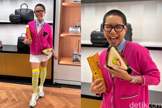Cadbury Lemonade aka Mbak Tumbas mencuri atensi di Kate Spade Grand Indonesia Opening Party. Influencer fashion yang populer dengan gaya nyentriknya itu tampil memakai Noel Cardigan berwarna pink dan koleksi tas 3D berbentuk sandwich. Foto: dok. R Chairini Putong/Wolipop