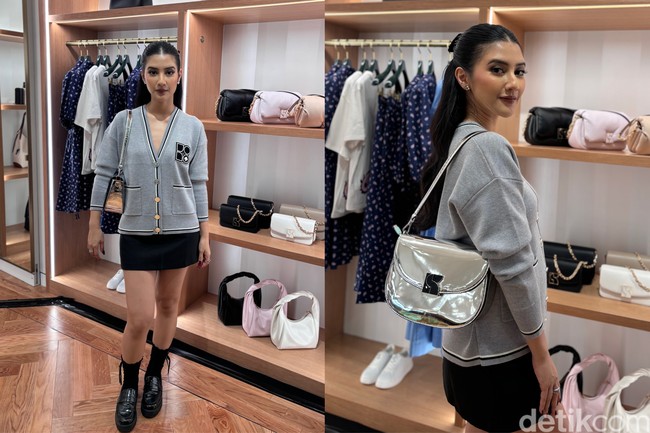 Bintang film Home Sweet Loan, Fita Anggriani tampil dengan gaya preppy dalam balutan cardigan dan mini skirt. Dakota Metallic Saddle Bag jadi koleksi favoritnya di butik Kate Spade Grand Indonesia. Foto: dok. R Chairini Putong/Wolipop