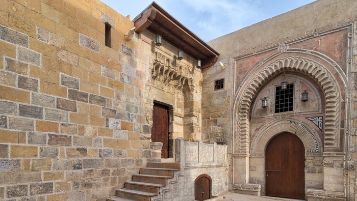 Gate of Darb Al Labana, a Bahari Mameluke era gate with small iron bars window and decorated with wooden and stone decorative elements with geometric designs, and gate of Tekkeyet Al-Bustami