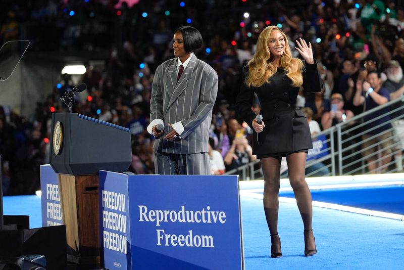 Musical artist Beyonce, right, and Democratic presidential nominee Vice President Kamala Harris, left, embrace on stage during a campaign rally Friday, Oct. 25, 2024, in Houston. (AP Photo/Annie Mulligan)