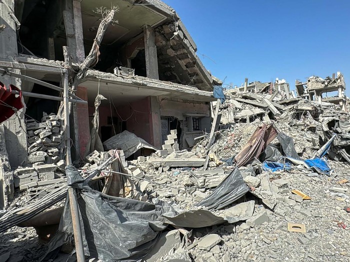 Palestinians view the damage after Israeli forces withdrew from the area around Kamal Adwan hospital, amid the ongoing Israel-Hamas conflict, in Jabalia, in the northern Gaza Strip October 26, 2024. REUTERS/Stringer