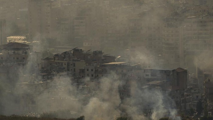 Smoke rises from an Israeli airstrike in Dahiyeh, Beirut, Sunday, Oct. 27, 2024. (AP Photo/Hassan Ammar)