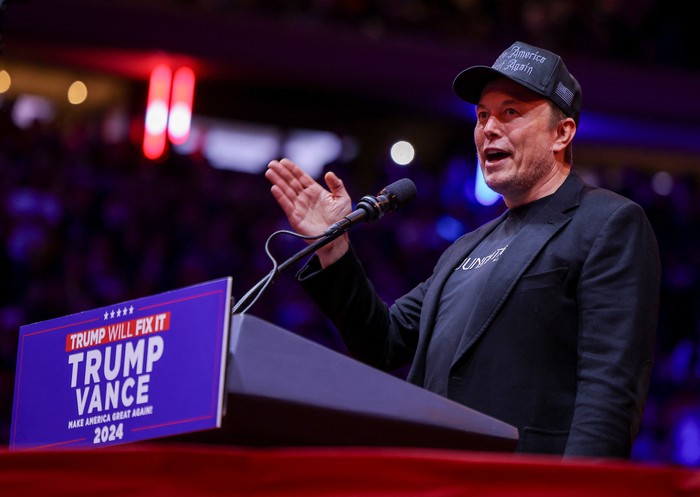 Tesla CEO and X owner Elon Musk speaks during a rally for Republican presidential nominee and former U.S. President Donald Trump at Madison Square Garden, in New York, U.S., October 27, 2024. REUTERS/Carlos Barria