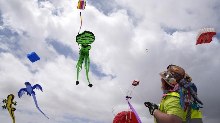 South African kite maker Mari Ware-Lane flies kites at the Cape Town International Kite Festival in Cape Town, South Africa, Sunday, Oct. 27, 2024. (AP Photo/Nardus Engelbrecht)