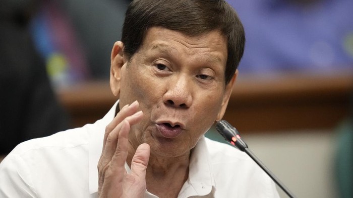 Former Philippine President Rodrigo Duterte gestures during a senate inquiry on the so-called war on drugs during his administration at the Philippine Senate Monday, Oct. 28, 2024, in Manila, Philippines. (AP Photo/Aaron Favila)