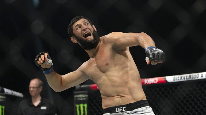 Khamzat Chimaev celebrates his win over Robert Whittaker in a middleweight mixed martial arts bout at UFC Fight Night on Saturday, Oct. 26, 2024, in Abu Dhabi, United Arab Emirates. (AP Photo/Altaf Qadri)