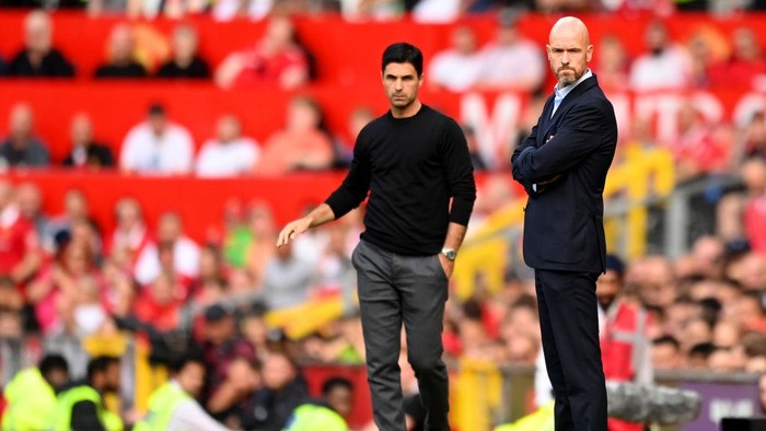 MANCHESTER, ENGLAND - SEPTEMBER 04: Mikel Arteta, Manager of Arsenal and Erik ten Hag, Manager of Manchester United look on during the Premier League match between Manchester United and Arsenal FC at Old Trafford on September 04, 2022 in Manchester, England. (Photo by Michael Regan/Getty Images)