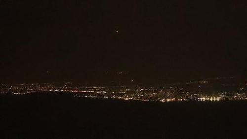 This picture taken from the Israeli port city of Haifa shows an expolosion (top C) as Israels Iron Dome air defence system intercepts rockets fired from Lebanon over the area of Acre in northern Israel, on October 30, 2024, amid the ongoing war between Israel and Hezbollah. (Photo by Ahmad GHARABLI / AFP)