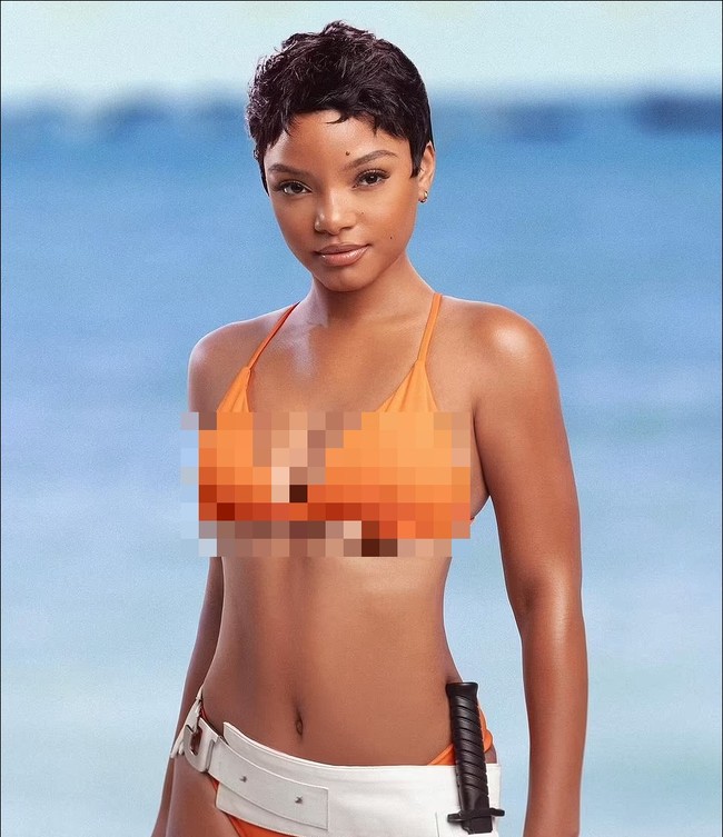 Aktris Halle Bailey menirukan gaya seniornya yang memiliki nama mirip dengannya Halle Berry. Bailey tampil memakai bikini oranye seperti Berry dalam film James Bond, Die Another Day yang dirilis pada 2002. Foto: Instagram