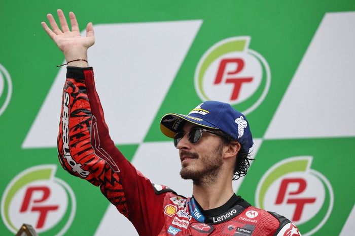 MotoGP - Thailand Grand Prix - Chang International Circuit, Buriram, Thailand - October 27, 2024 Ducati Lenovo Teams Francesco Bagnaia celebrates on the podium after winning the MotoGP REUTERS/Athit Perawongmetha
