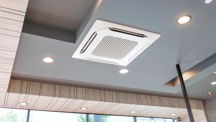 Modern ceiling mounted cassette type air conditioning system in coffee shop