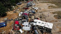 Dengan jumlah korban tewas sudah lebih dari 200 setelah hujan setara setahun turun dalam sehari di beberapa bagian Spanyol timur dan selatan, analisis cepat ilmuwan iklim menunjukkan pemanasan global membuat peristiwa itu dua kali lebih mungkin terjadi dan hujan deras jauh lebih deras. AP/Manu Fernandez