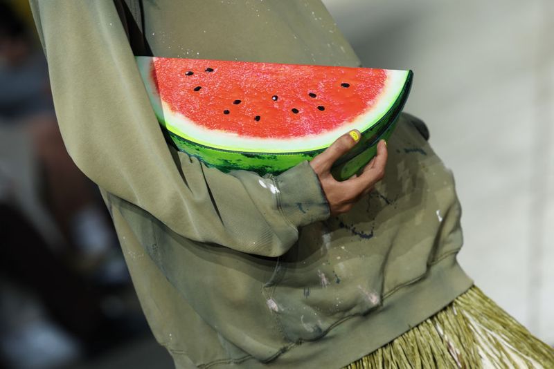 MILAN, ITALY - JUNE 14: A model, handbag detail, walks the runway at the Moschino fashion show during the Milan Menswear Spring/Summer 2025 on June 14, 2024 in Milan, Italy. (Photo by Vittorio Zunino Celotto/Getty Images)