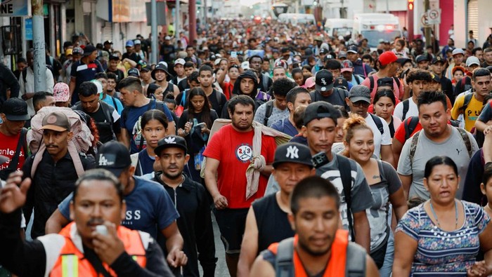 A drone view shows migrants walking in a caravan during U.S. Presidential election day, in an attempt to reach Mexico's northern border, in Tapachula, Mexico November 5, 2024. REUTERS/Daniel Becerril